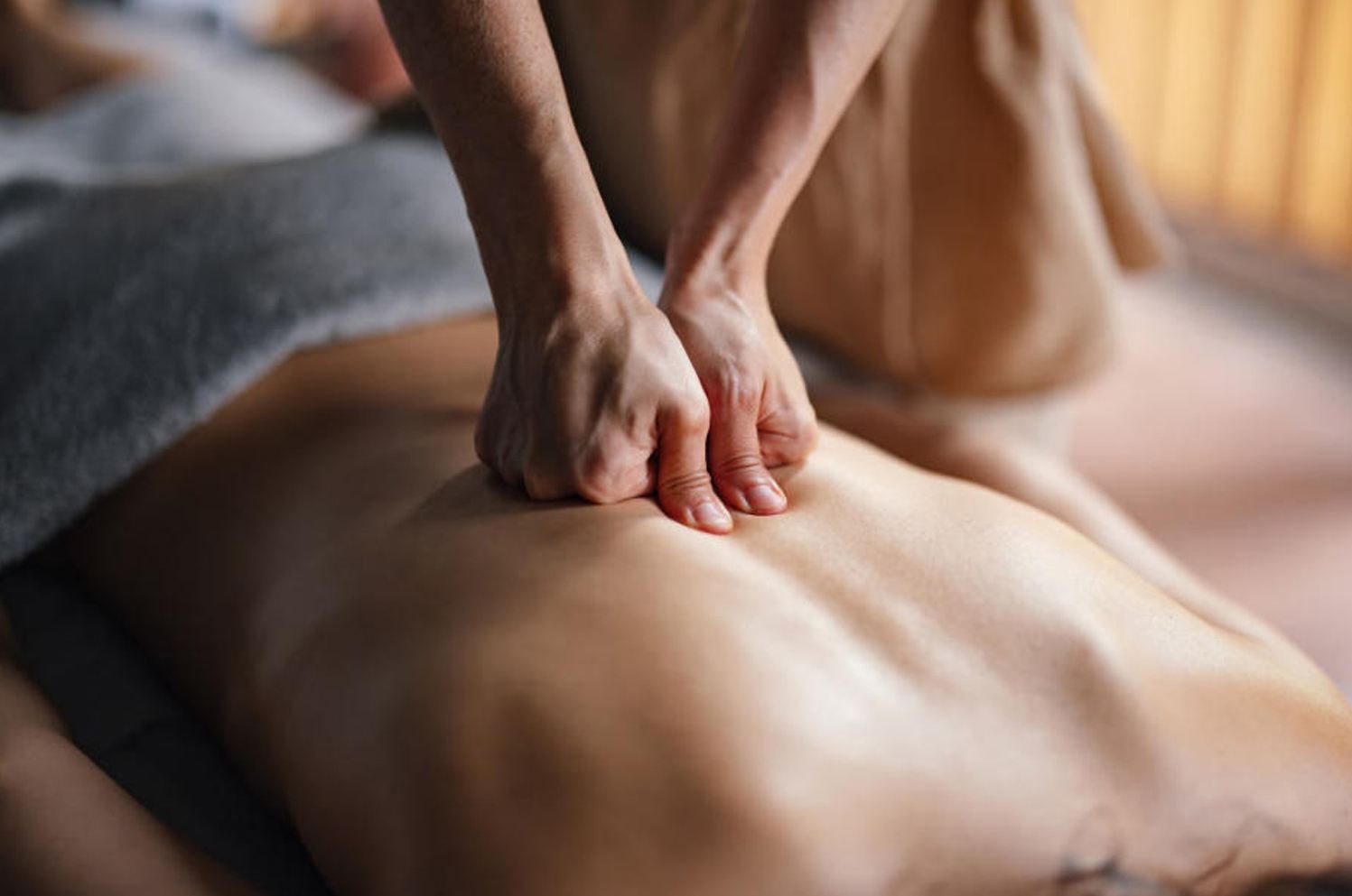 Therapist applying focused pressure on shoulders during a Stress Relief massage at Cozy Massage Spa North Hollywood
